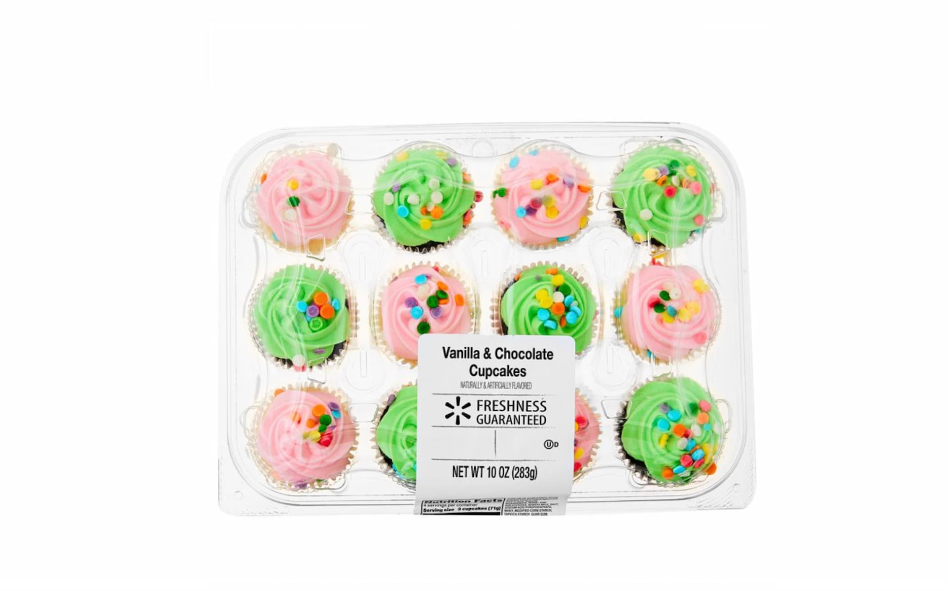 A clear plastic container with 12 cupcakes, six with pink frosting and six with green frosting, all decorated with colorful sprinkles. The label reads "Vanilla & Chocolate Cupcakes.