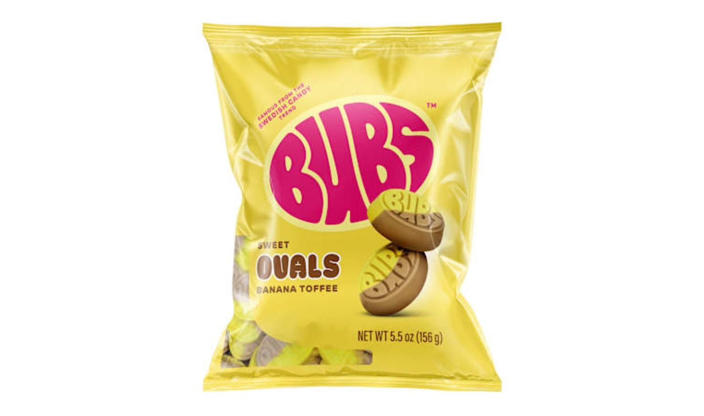 A yellow bag of Bubs Sweet Ovals Banana Toffee candy, featuring round brown and yellow candies with the Bubs logo and "banana toffee" text on the packaging. Discover this tasty treat among new Five Below products. Net weight is 5.5 oz (155 g).