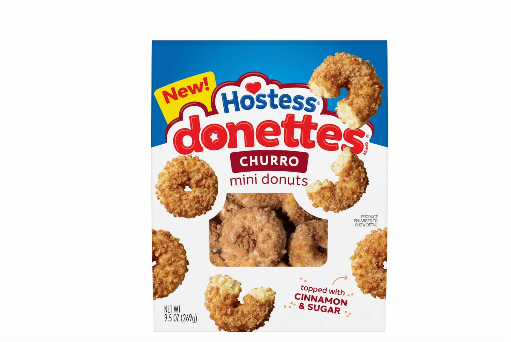A box of Hostess Donettes Churro mini donuts. The packaging is mostly blue and white with images of cinnamon sugar-coated mini donuts and text that reads “New!” and “Topped with cinnamon & sugar.”