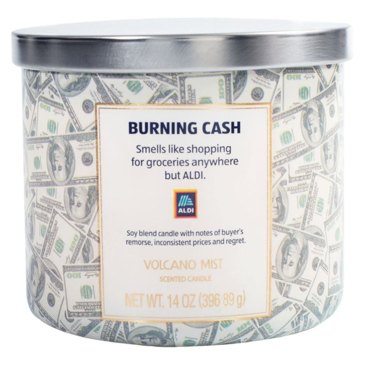 A candle in a jar decorated with $100 bills. The label reads: "BURNING CASH. Smells like shopping for groceries anywhere but ALDI. Soy blend candle with notes of buyer's remorse, inconsistent prices and regret. VOLCANO MIST.