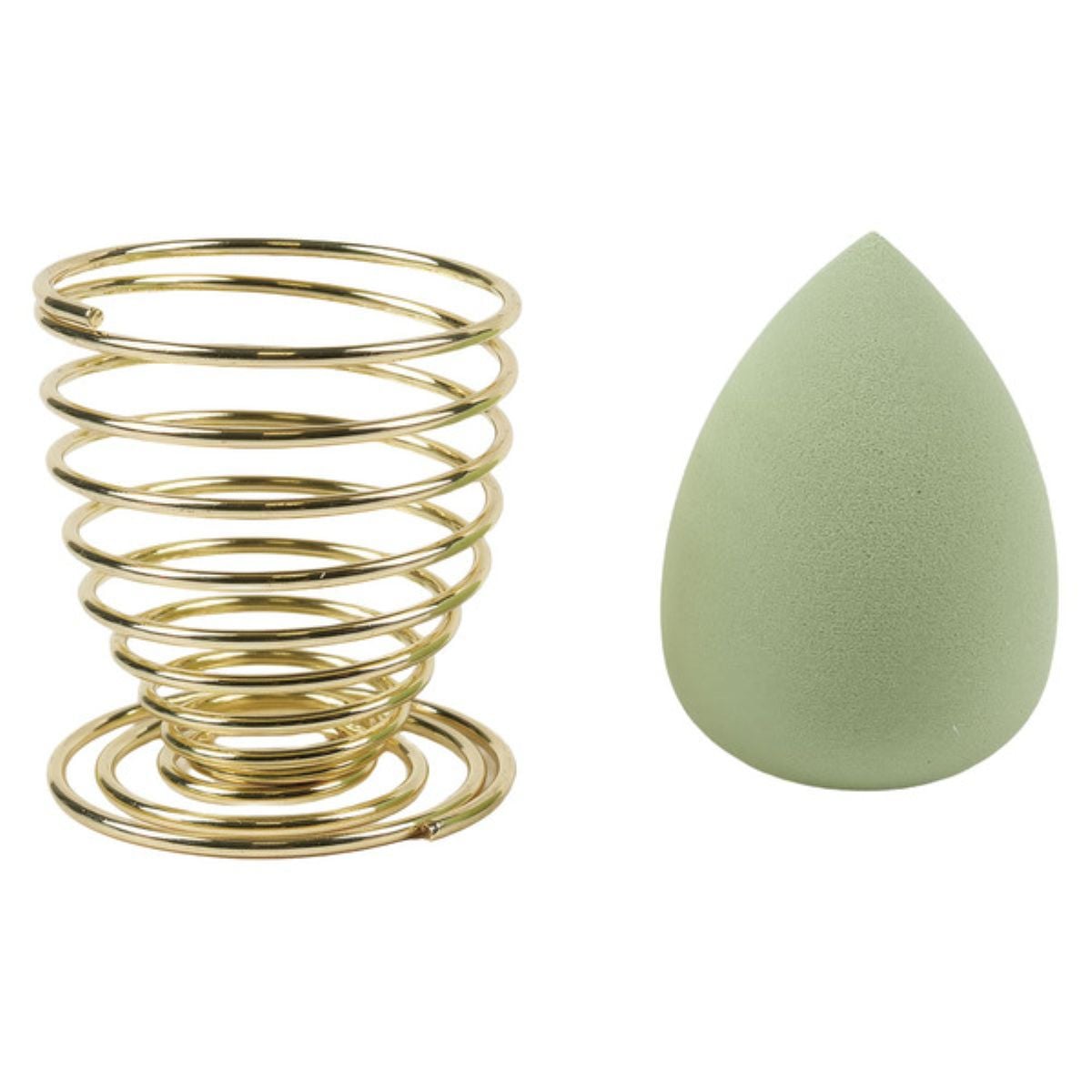 A gold spiral makeup sponge holder is next to a green teardrop-shaped makeup sponge, both placed on a white background.