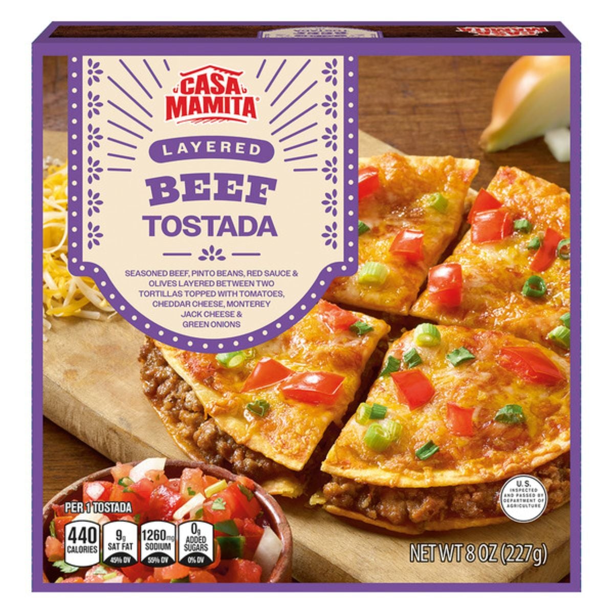 Casa Mamita Layered Beef Tostada box showing a sliced tostada topped with cheese, tomatoes, and peppers. Text highlights calories, serving size, and nutritional info. The package is purple with decorative accents.
