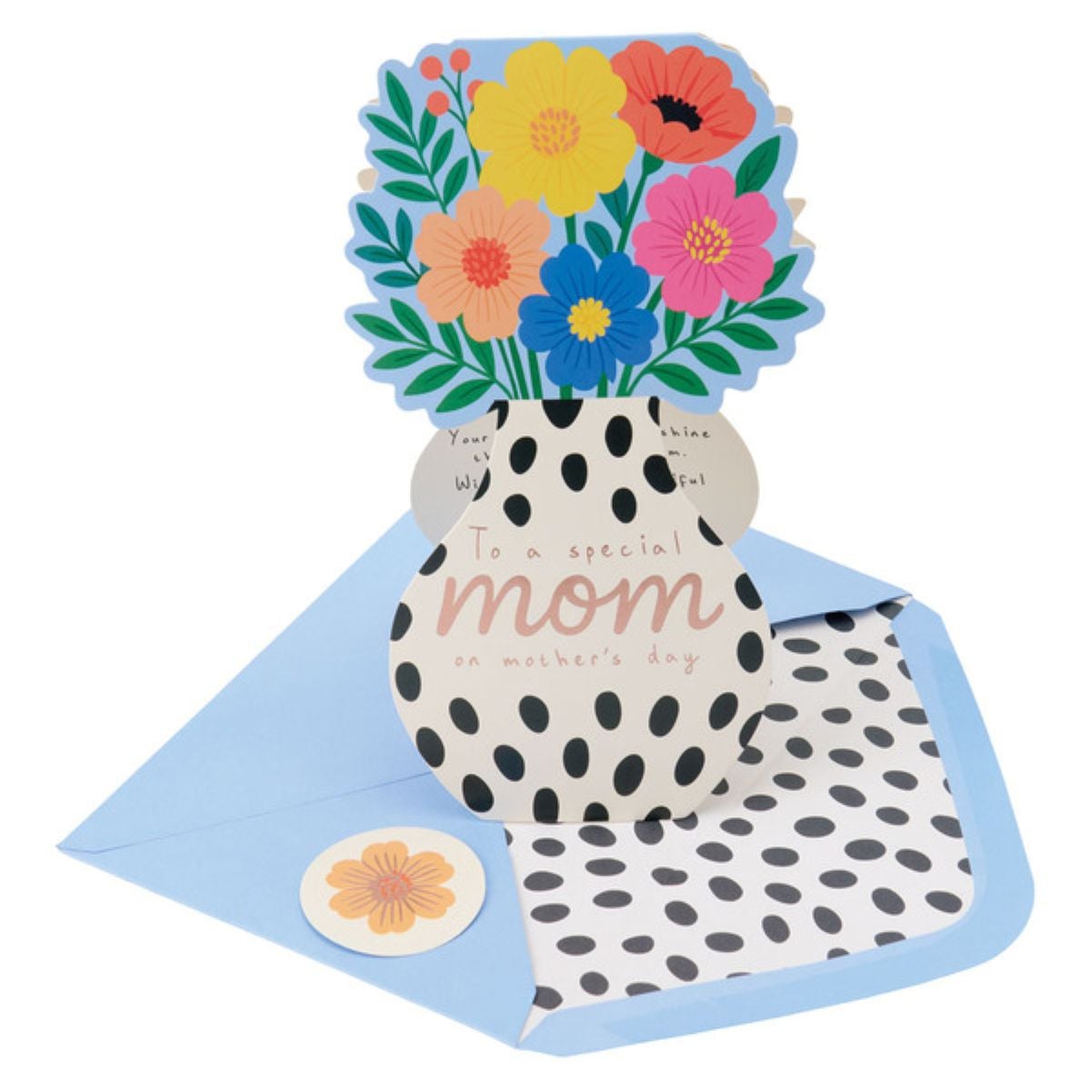 A pop-up Mother’s Day card shaped like a vase with colorful flowers, reading “To a special mom on mother’s day,” alongside a blue envelope with a black-and-white polka dot liner and a matching sticker.