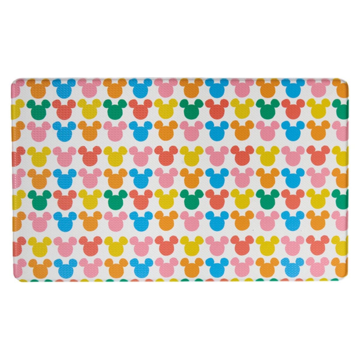 A rectangular mat featuring a repeating pattern of Mickey Mouse head silhouettes in pastel colors: yellow, pink, blue, green, and orange, arranged evenly on a white background.