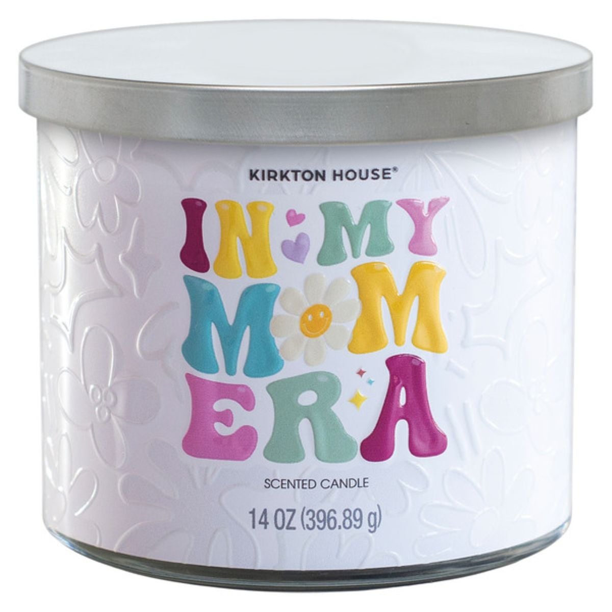 A white 14 oz scented candle with a silver lid. The label reads "In My Mom Era" in colorful, playful letters, and "Kirkton House" above. The background features embossed flower patterns.