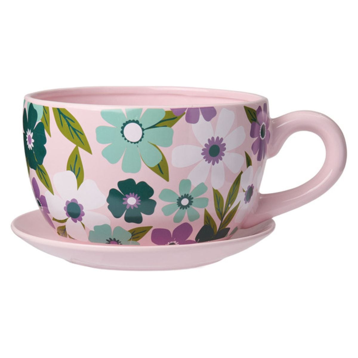 A large pink teacup with a matching saucer, decorated with a colorful floral pattern featuring blue, green, purple, and white flowers and green leaves.