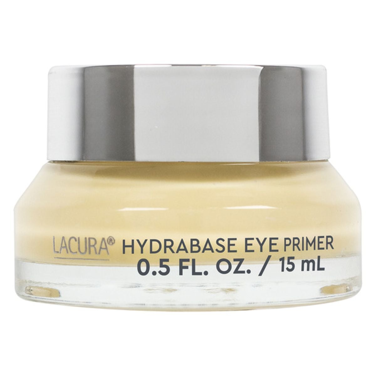 A small glass jar with a silver lid containing Lacura Hydrabase Eye Primer, labeled as 0.5 fl. oz. (15 mL). The creamy product inside is light beige in color.