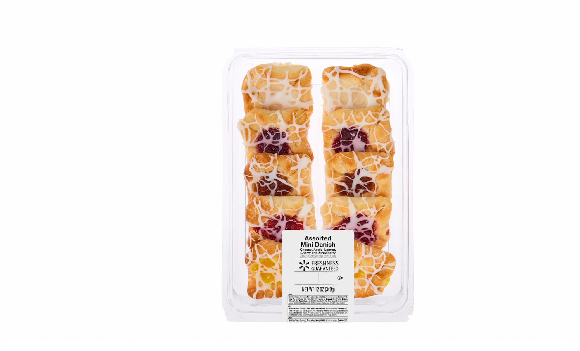 A clear plastic container holds assorted mini Danish pastries with icing drizzle on top. The pastries are neatly arranged in rows, with visible fruit and cheese fillings. A label is on the packaging.