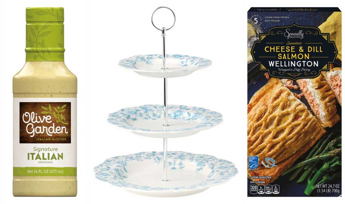 A bottle of Olive Garden Italian dressing, a three-tiered floral serving tray, and a box of Cheese & Dill Salmon Wellington—some of the exciting new Aldi products April 1—are displayed side by side against a white background.