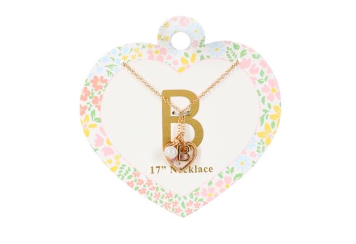 A gold necklace with a large "B" pendant, a small heart charm, and a pearl, displayed on heart-shaped floral packaging labeled "17'' Necklace" from five below.