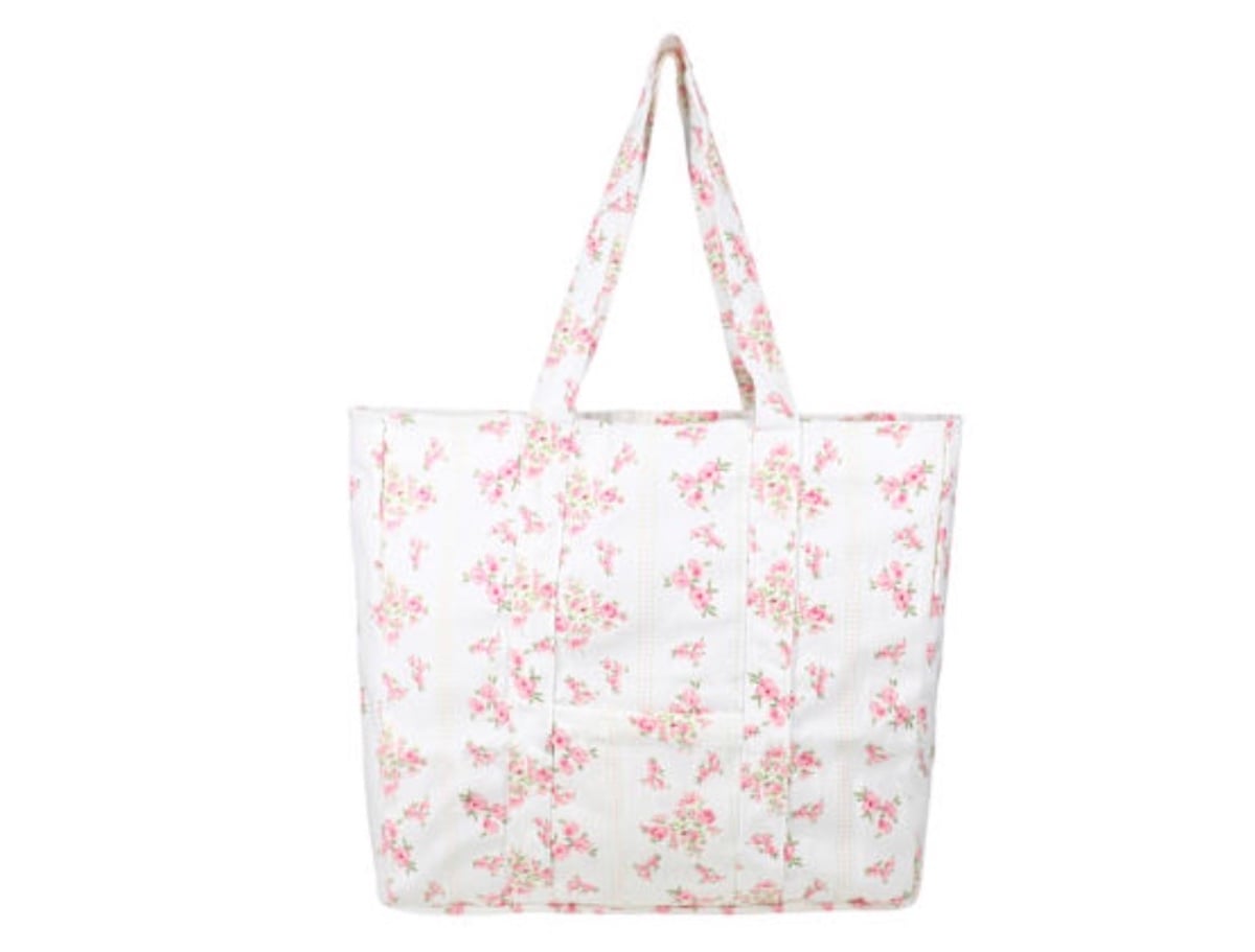 A white tote bag with pink floral patterns, featuring two handles and a spacious rectangular shape, reminiscent of stylish finds at Five Below, set against a plain white background.