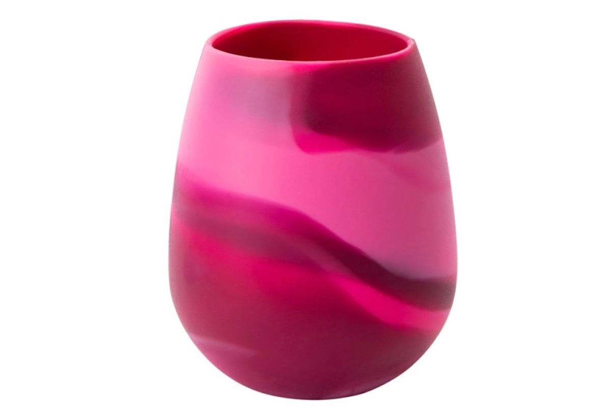 A silicone cup with a smooth, rounded shape featuring a marbled pattern in various shades of pink and magenta—perfect for adding five below style to your collection.