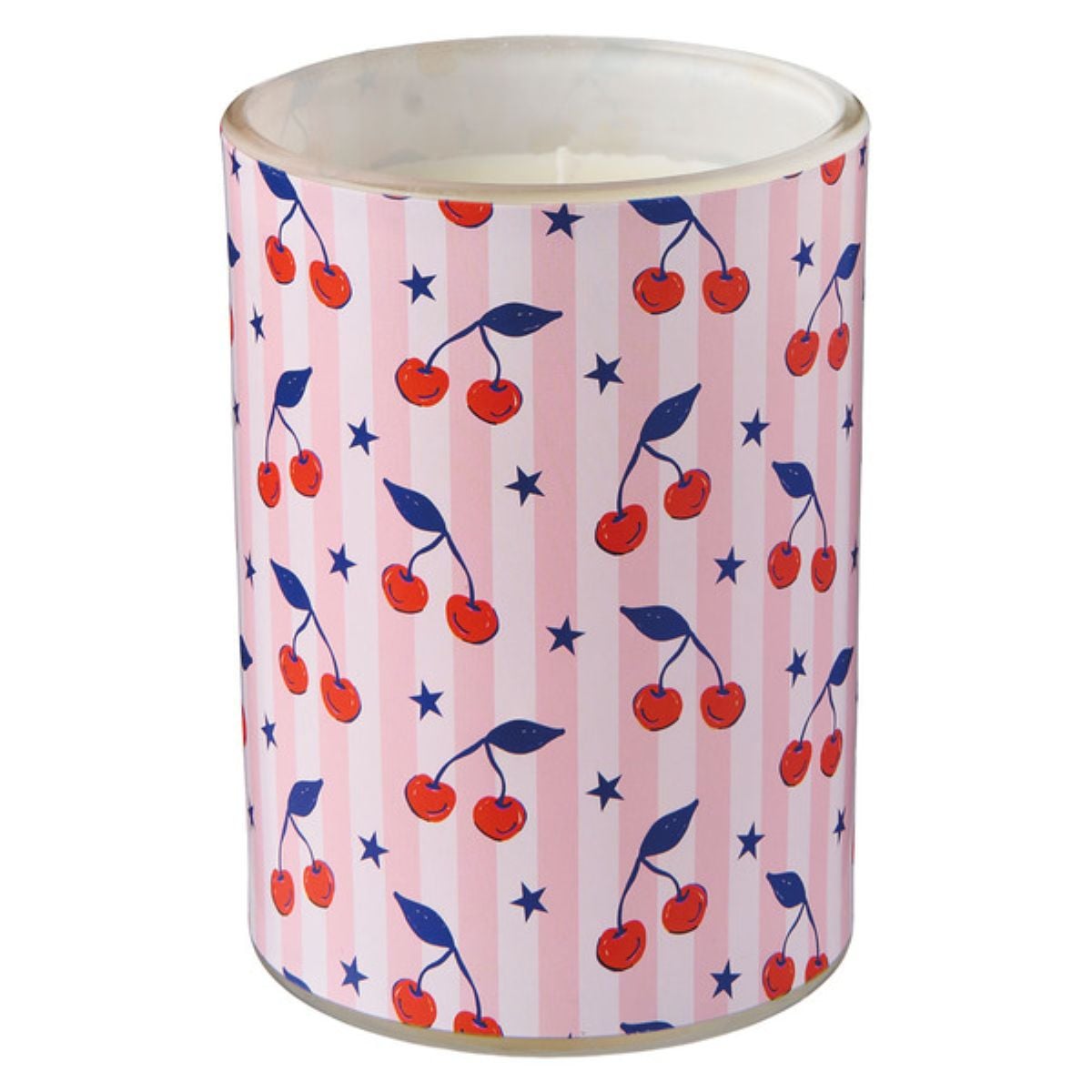 A white candle in a glass holder decorated with pink and white vertical stripes, red cherries with green leaves, and small blue stars.