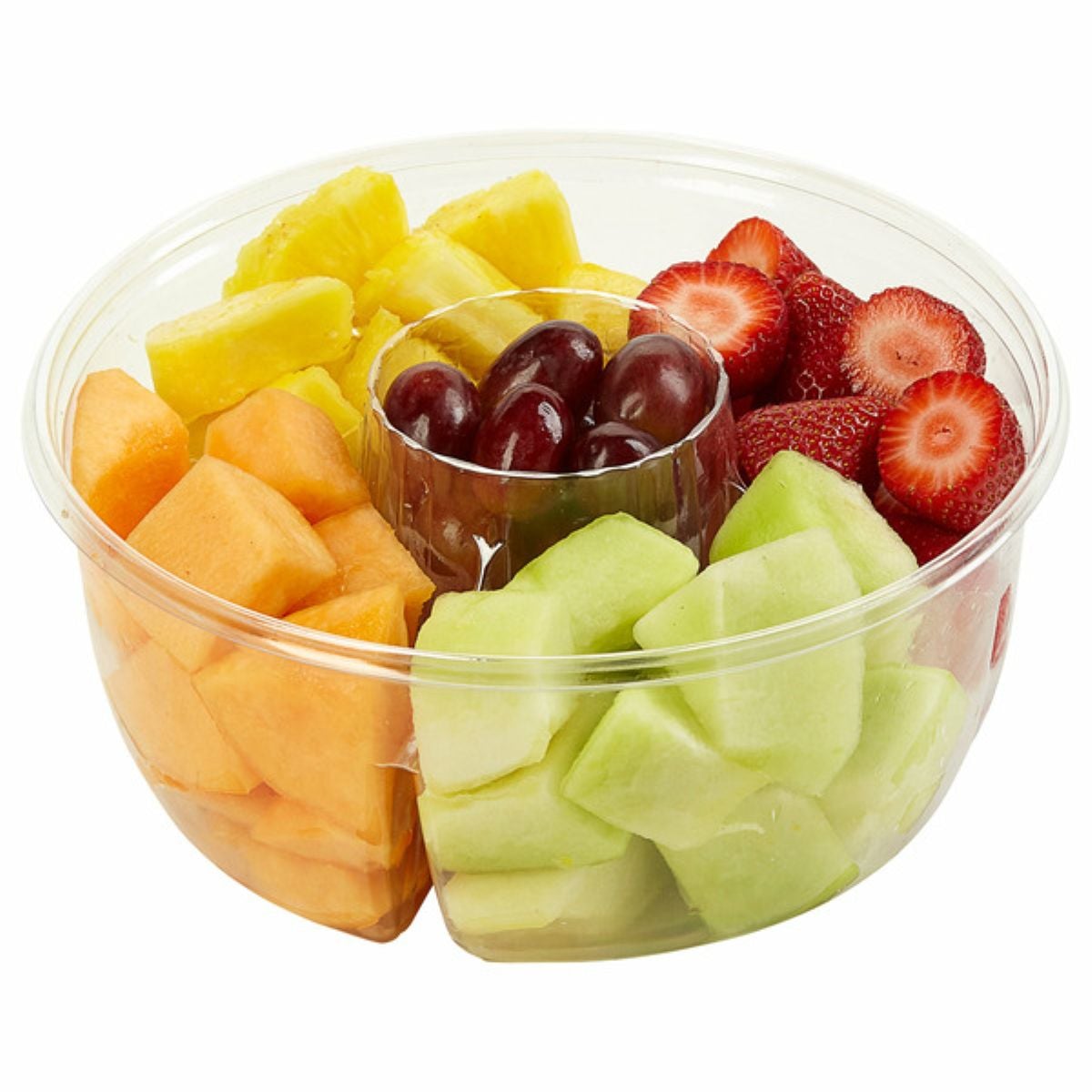 A clear plastic bowl with sections holding cut pineapple, strawberries, green melon, cantaloupe, and red grapes in the center.