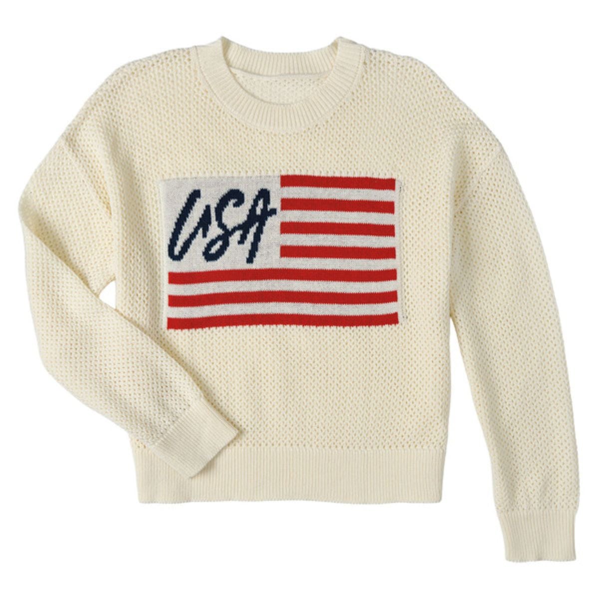 Cream-colored knit sweater with a rectangular patch featuring red and white stripes, the word "USA" in blue script, and a blue field in the upper left corner, resembling an American flag design.