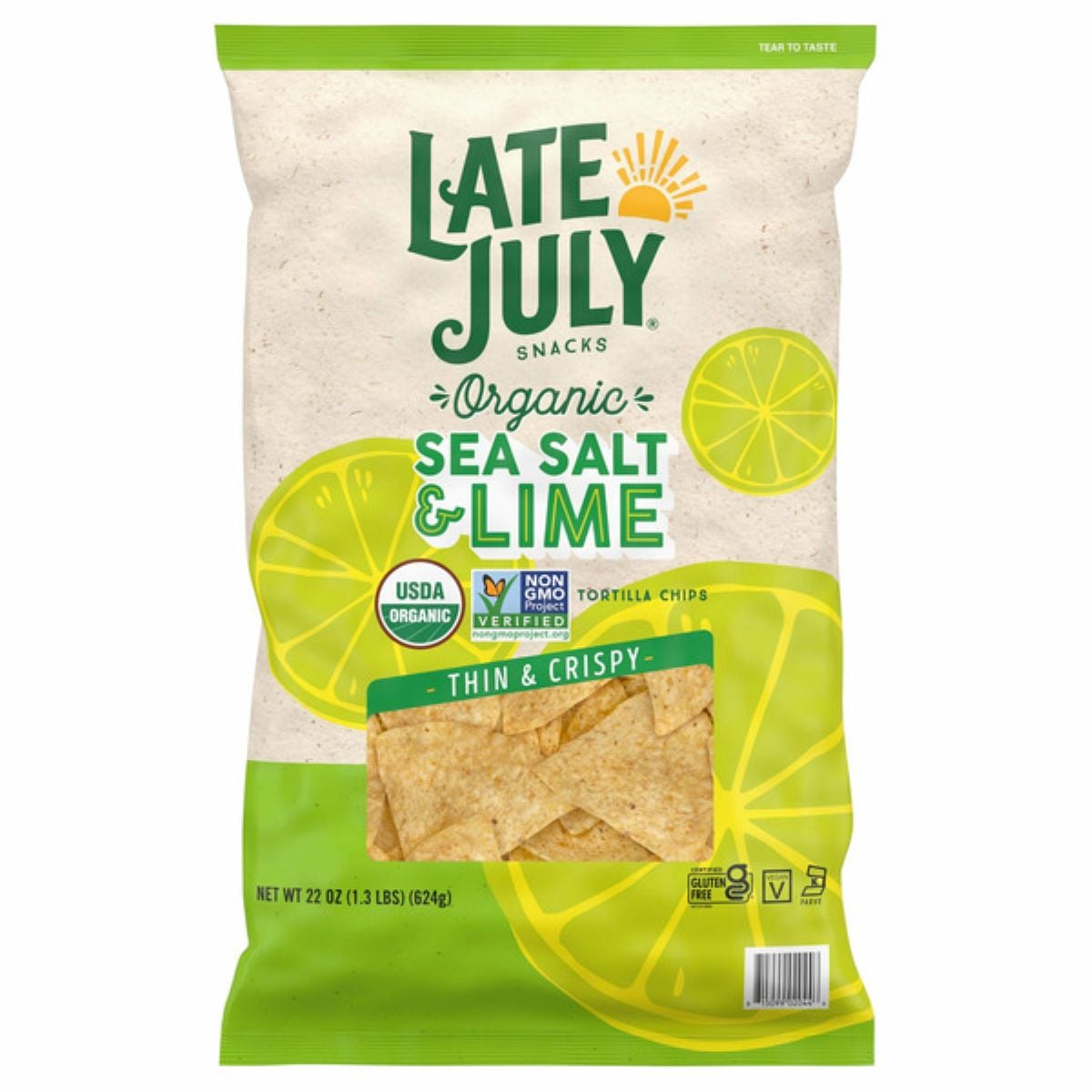 A bag of Late July Snacks Organic Sea Salt & Lime thin and crispy tortilla chips. The packaging features lime slices and labels showing USDA Organic and Non-GMO Project Verified certifications.