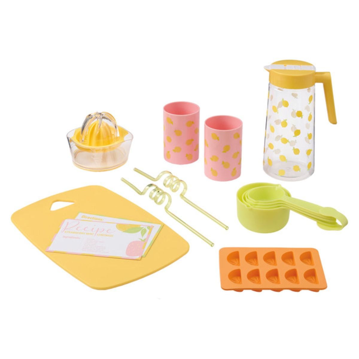 A toy lemonade set including a chopping board, recipe cards, lemon squeezer, two pink cups with lemon prints, a pitcher, two curly straws, measuring cups, and an ice cube tray with heart-shaped molds.