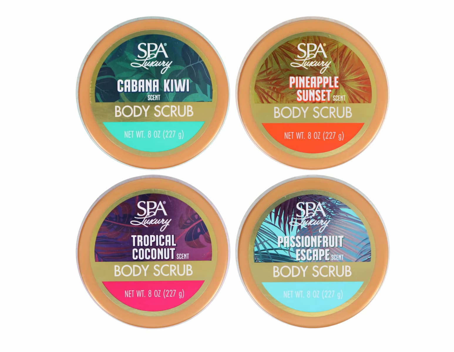 Four round containers of SPA Luxury body scrub in different scents: Cabana Kiwi, Pineapple Sunset, Tropical Coconut, and Passionfruit Escape, each with colorful tropical-themed lids.