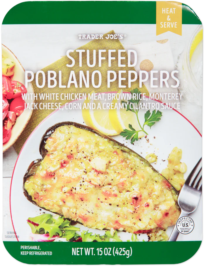 Trader Joe’s stuffed poblano peppers package, showing a cooked poblano pepper filled with a white chicken, brown rice, cheese, corn, and cilantro sauce mixture, garnished with herbs on a white plate.