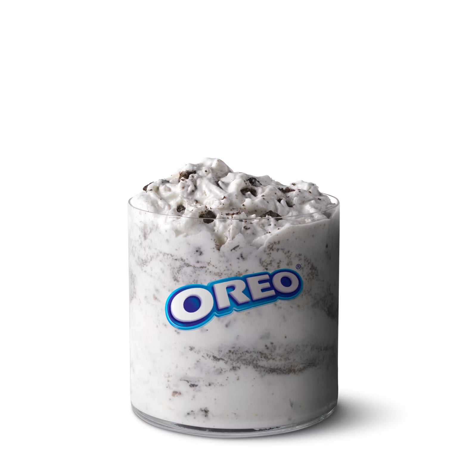A glass filled with creamy Oreo-flavored dessert, swirled with dark cookie crumbs, and topped with extra cookie pieces—a favorite among fast-food desserts. The glass features the iconic Oreo logo on the front.