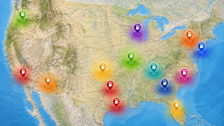 A map of the United States with colorful location markers across various regions, each featuring a gas pump icon, indicating different fuel-related locations or data points.