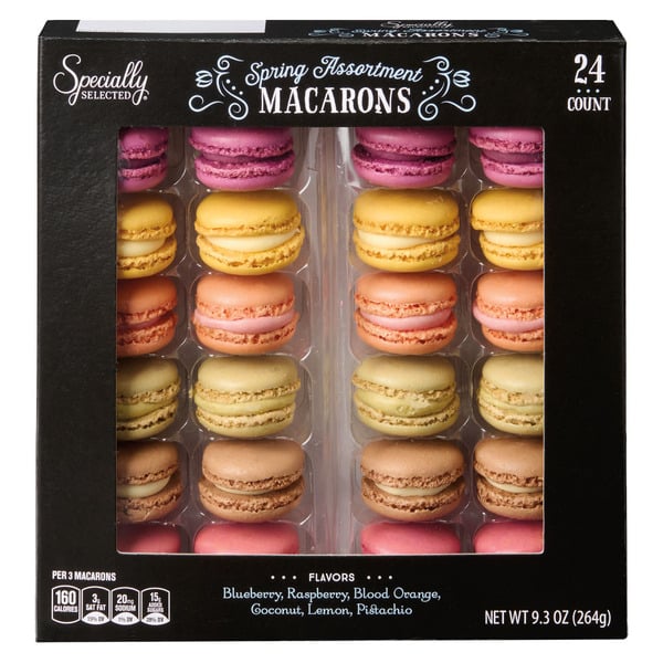 A black box labeled "Spring Assortment Macarons" displays 24 colorful macarons in rows. Flavors listed include blueberry, raspberry, blood orange, coconut, lemon, and pistachio.
