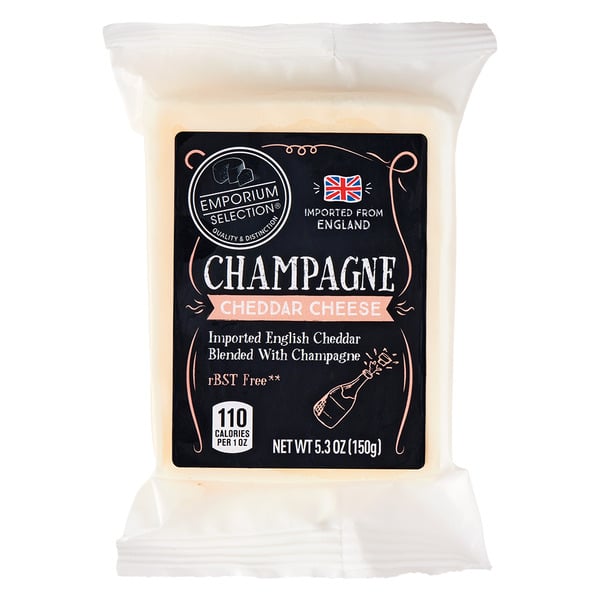 A package of Emporium Selection Champagne Cheddar Cheese, featuring English cheddar blended with champagne. The label shows a champagne bottle graphic and indicates 110 calories per ounce and a net weight of 5.3 oz (150g).