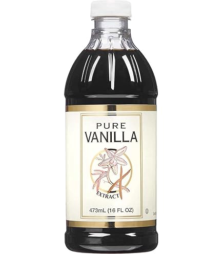 A bottle of pure vanilla extract with a white cap and a cream-colored label featuring an illustration of vanilla flowers. The bottle holds 473 mL (16 fl oz) of extract.