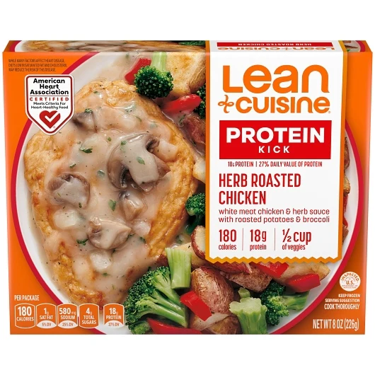 Lean Cuisine Protein Kick Herb Roasted Chicken frozen meal box showing chicken in herb sauce with potatoes and broccoli, displaying nutrition facts, portion size, and an American Heart Association certification.