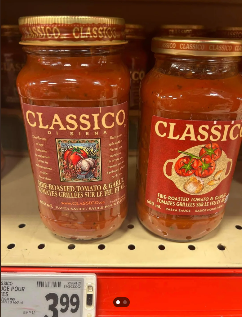 Two jars of Classico Fire-Roasted Tomato & Garlic pasta sauce are on a store shelf. Each jar has a different label design, with the same product name and a price tag below showing $3.99.