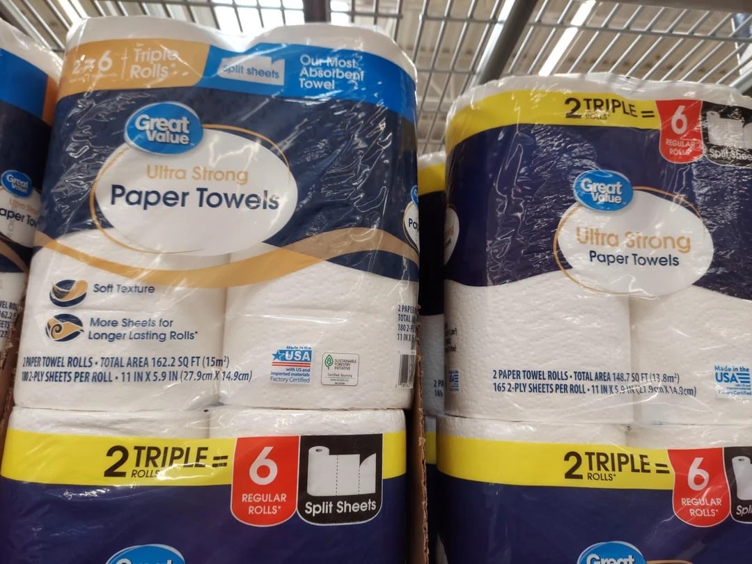 Close-up of Great Value Ultra Strong Paper Towels, a popular Walmart product. The packaging highlights "2 Triple Rolls = 6 Regular Rolls," "Soft Texture," "More Sheets," and "Split Sheets" in-store.