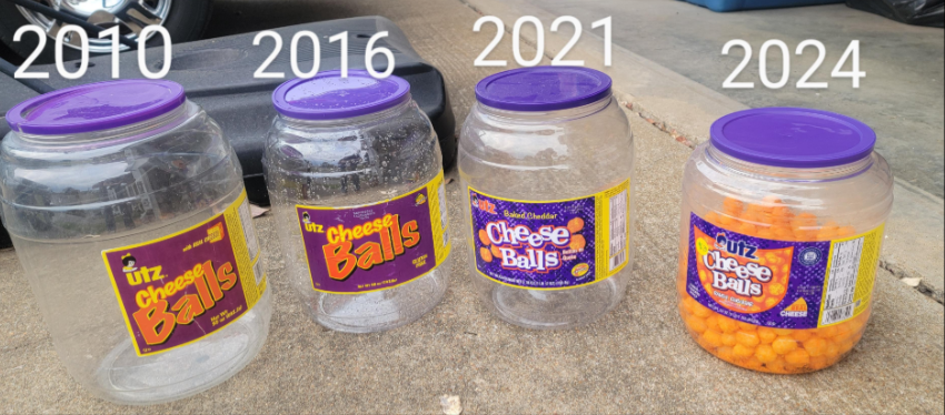 Four Utz cheese ball containers from 2010, 2016, 2021, and 2024, each progressively smaller, are lined up outdoors. If you think brands are going to shrink products, the tiny 2024 container—with just a few cheese balls—proves it.
