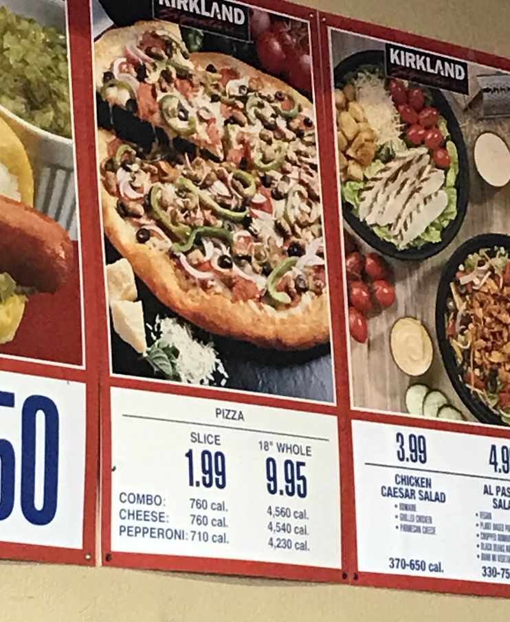A menu board displays popular pizza chain options with a photo of a pizza topped with mushrooms, green peppers, olives, and pepperoni. Prices and calories for slice and whole pizza selections are listed below the image.