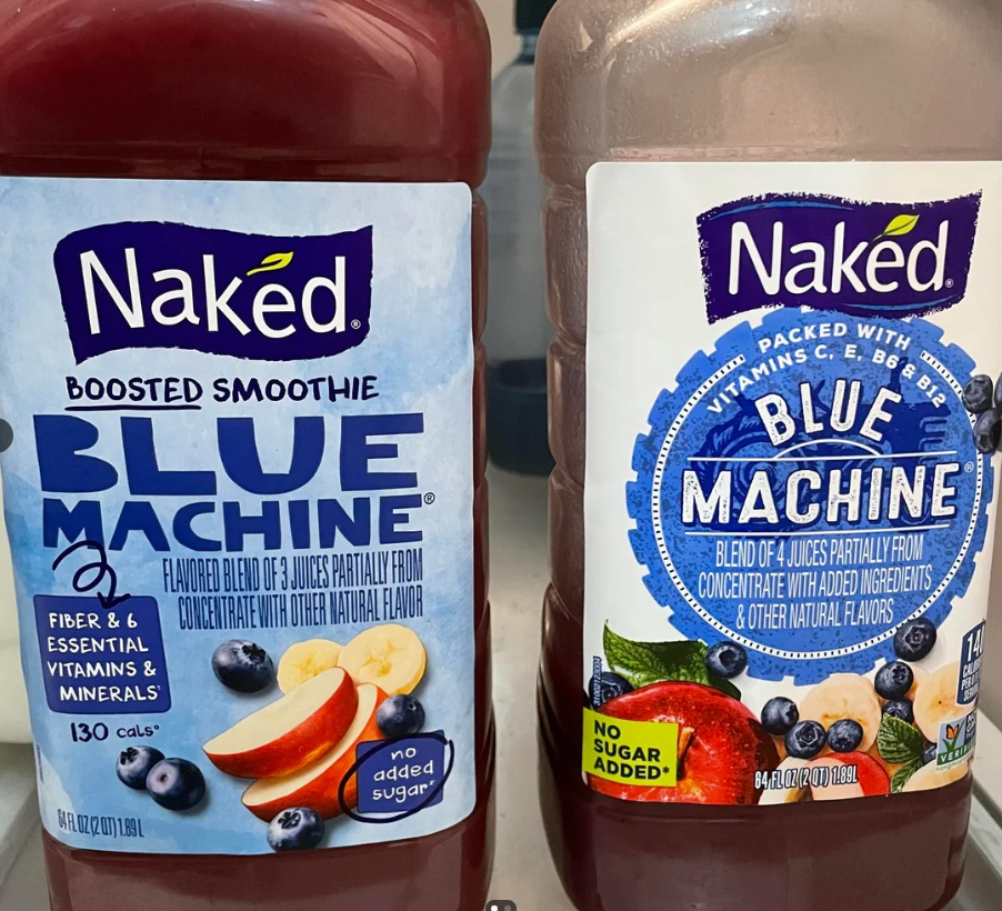 Two bottles of Naked Blue Machine smoothie sit side by side. Both labels feature images of blueberries and apple slices, with text highlighting vitamins, fiber, and that there is no sugar added.