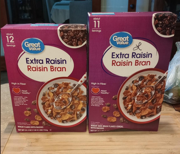 Two boxes of Great Value Extra Raisin Raisin Bran cereal sit on a table. The left box has 12 servings, and the right box has 11 servings. Both feature a bowl of cereal with raisins and flakes on the front.