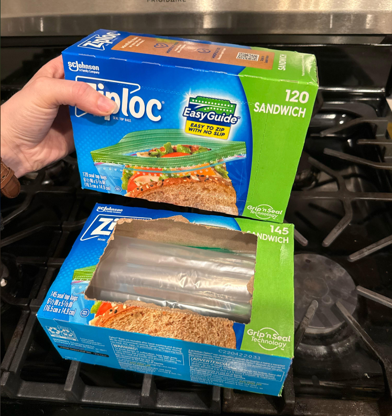 A hand holds a new unopened box of Ziploc sandwich bags above an empty Ziploc sandwich bag box on a stovetop. The new box contains 120 bags, and the empty box originally contained 145 bags.