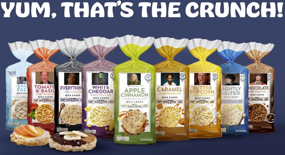 A lineup of nine rice cake packages in various flavors stands in front of a blue background with the text “YUM, THAT’S THE CRUNCH!” above. Different toppings and rice cakes are displayed in front of the packages.