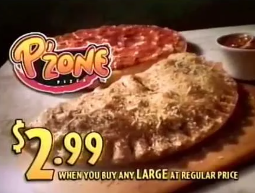A Pizza Hut P'Zone calzone is shown on a wooden board next to a pizza and a cup of marinara sauce. Text reads: "P'Zone Pizza $2.99 when you buy any large at regular price.