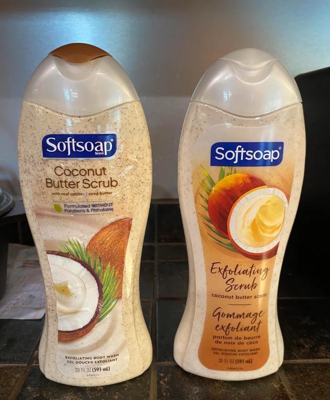 Two bottles of Softsoap body wash stand side by side. The left is “Coconut Butter Scrub”; the right is “Exfoliating Scrub.” Both are 20 oz—so you don’t have to pay more for less when choosing between these refreshing varieties.