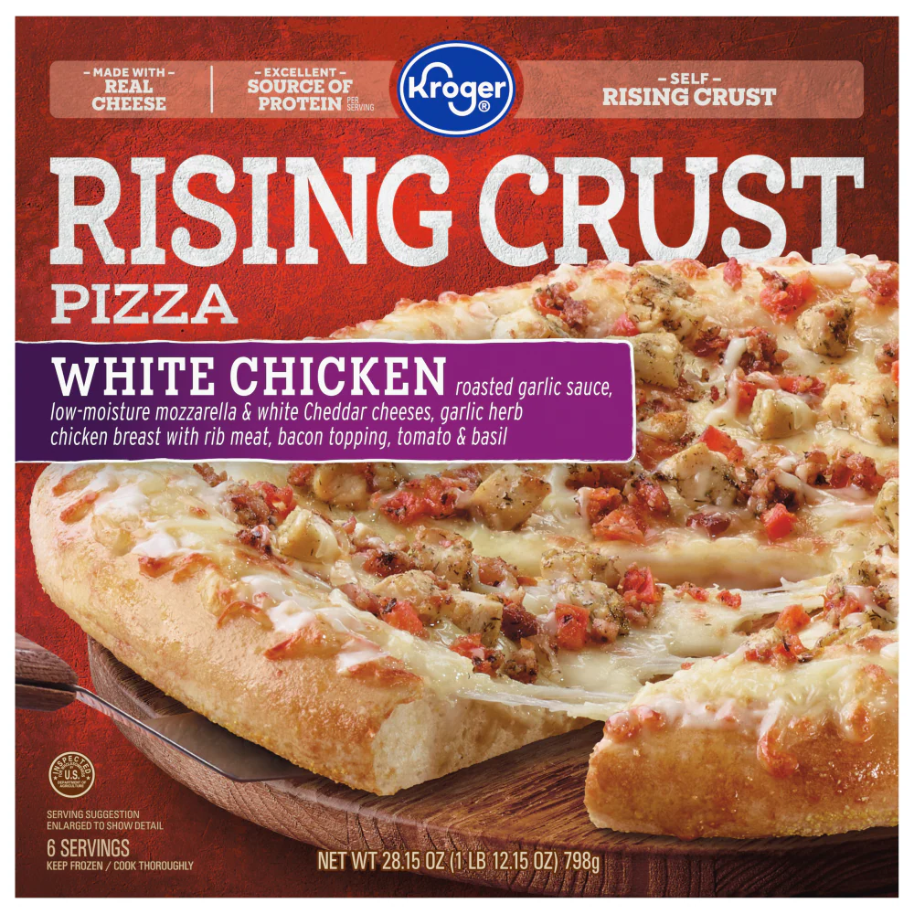 A Kroger Rising Crust Pizza box featuring a close-up image of a white chicken pizza topped with mozzarella, cheddar, tomato, herbs, bacon, and garlic sauce. The pizza has a thick, golden crust.