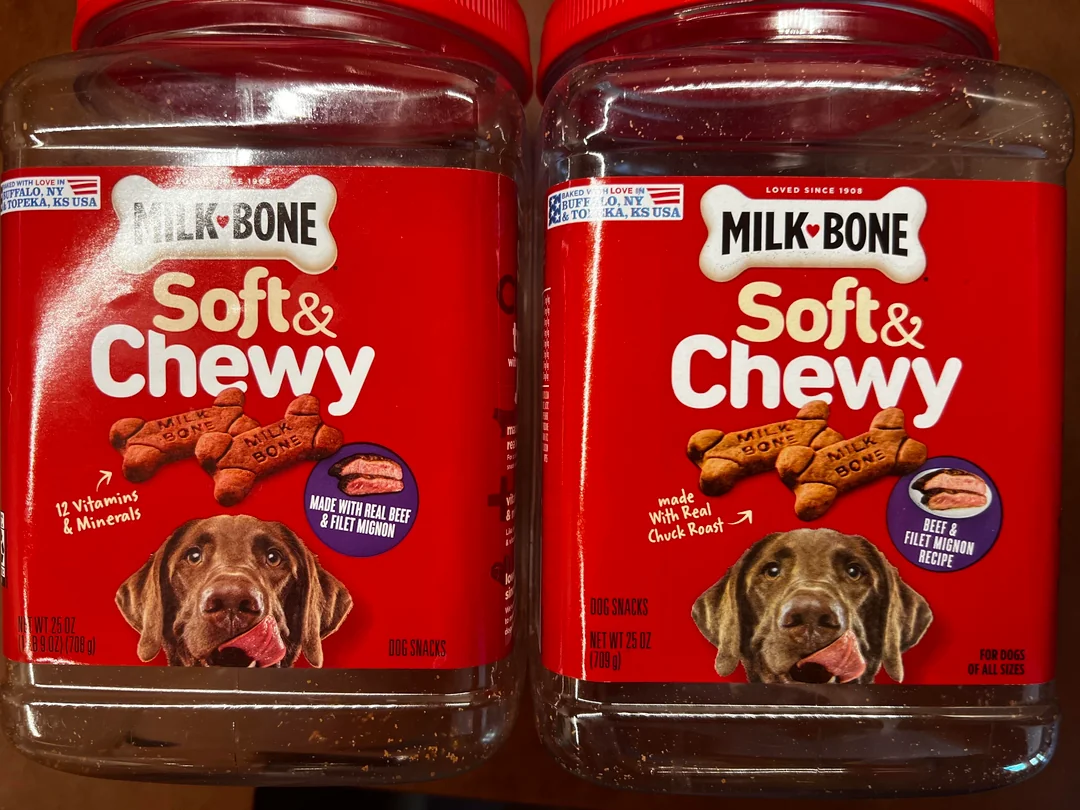 Two containers of Milk-Bone Soft & Chewy dog treats with red labels, images of the treats, and a brown dog on the front. The labels highlight beef flavor and added vitamins and minerals.
