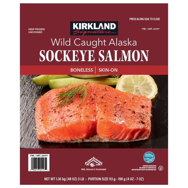 Package of Kirkland Signature Wild Caught Alaska Sockeye Salmon, boneless and skin-on, featuring an image of cooked salmon with asparagus and lemon slices on the front.