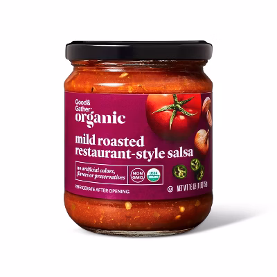 A glass jar of Good & Gather organic mild roasted restaurant-style salsa with a black lid. The label is purple with images of tomatoes and jalapeños and displays organic and non-GMO certification logos.