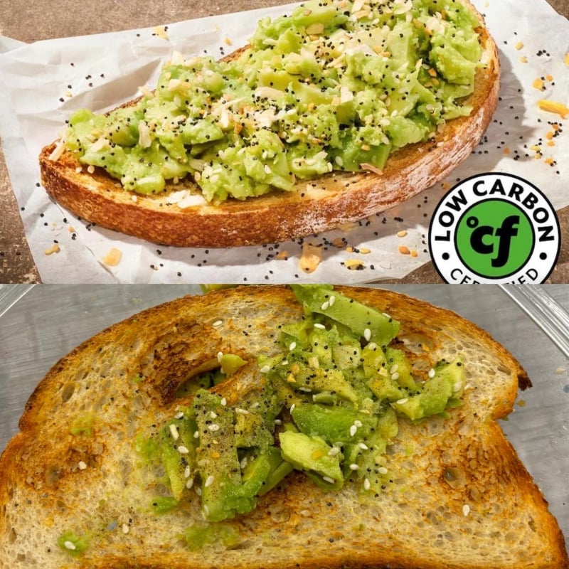 Two slices of toasted bread topped with smashed avocado and seasoning. The top slice is more generously covered and labeled "Low Carbon Certified," while the bottom slice has less avocado and seasoning.