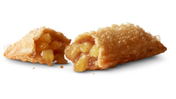 A golden, crispy pie shell filled with warm, gooey apple chunks and cinnamon, reminiscent of a classic fast food treat, shown cut open on a white background.