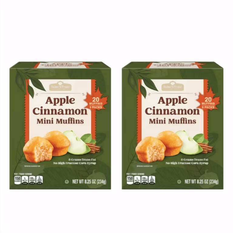 Two boxes of Apple Cinnamon Mini Muffins, each labeled with “20 muffins, 5 packs.” Boxes show images of muffins, apples, and cinnamon sticks. Packaging is green with nutrition highlights and net weight of 8.25 oz (234g).