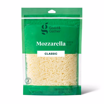 A green and clear bag of Good & Gather Classic Mozzarella shredded cheese. The label displays the brand name, product name, and a clear window shows the shredded cheese inside.