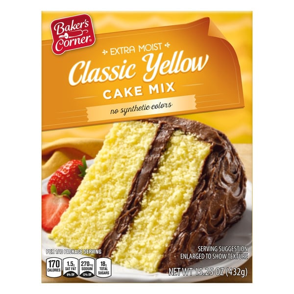 Box of Baker’s Corner Extra Moist Classic Yellow Cake Mix, featuring a slice of yellow cake with chocolate frosting and a strawberry, against a yellow background with a cake texture pattern.