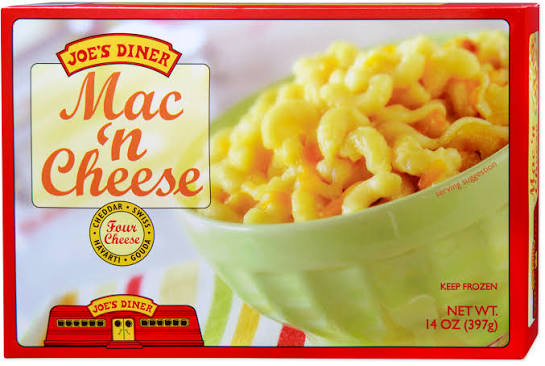 A red and yellow box of Joe’s Diner Mac ’n Cheese features a green bowl filled with macaroni and cheese. The box highlights "Four Cheese" and indicates a net weight of 14 oz (397g).