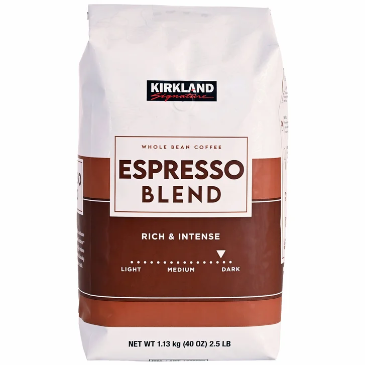 A white and brown bag of Kirkland Signature Espresso Blend whole bean coffee, labeled "Rich & Intense" and showing a dark roast level. The bag weighs 1.13 kg (40 oz) or 2.5 lb.